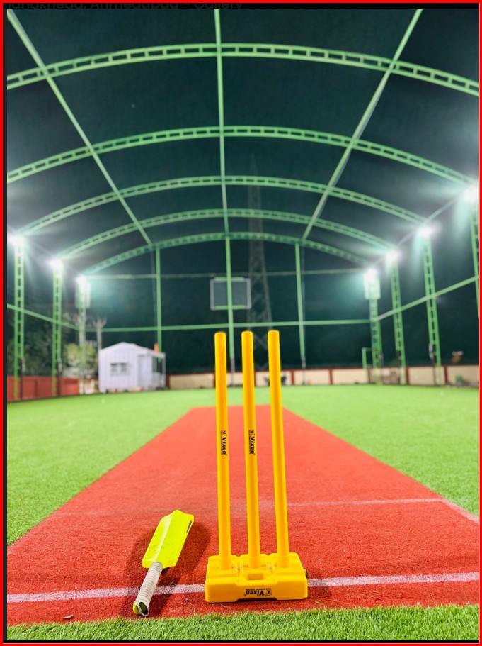 Cricket players competing in a box cricket tournament managed by GameBridge
